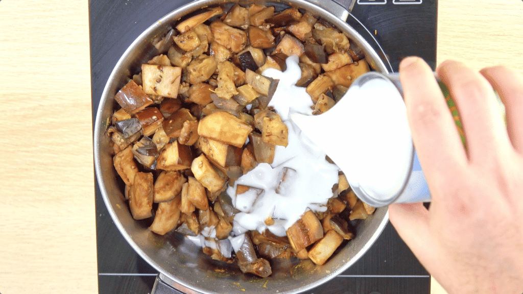 Return Aubergine to Pan with Coconut Milk