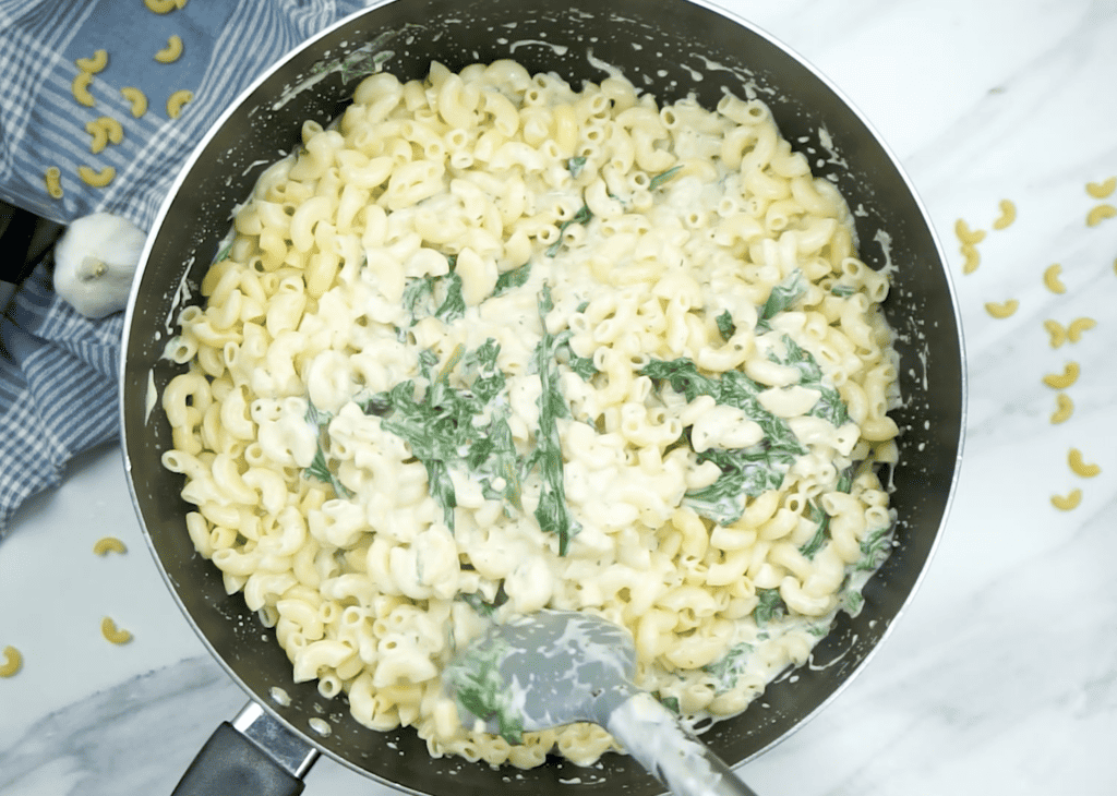 Creamy Spinach Pasta Recipe add pasta and stir